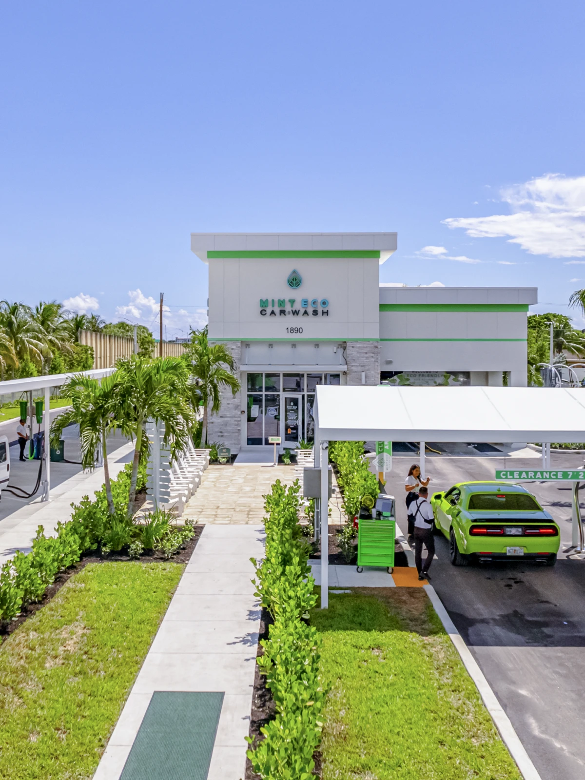 Aerial view of a Mint Eco Car Wash location with a green Dodge Challenger