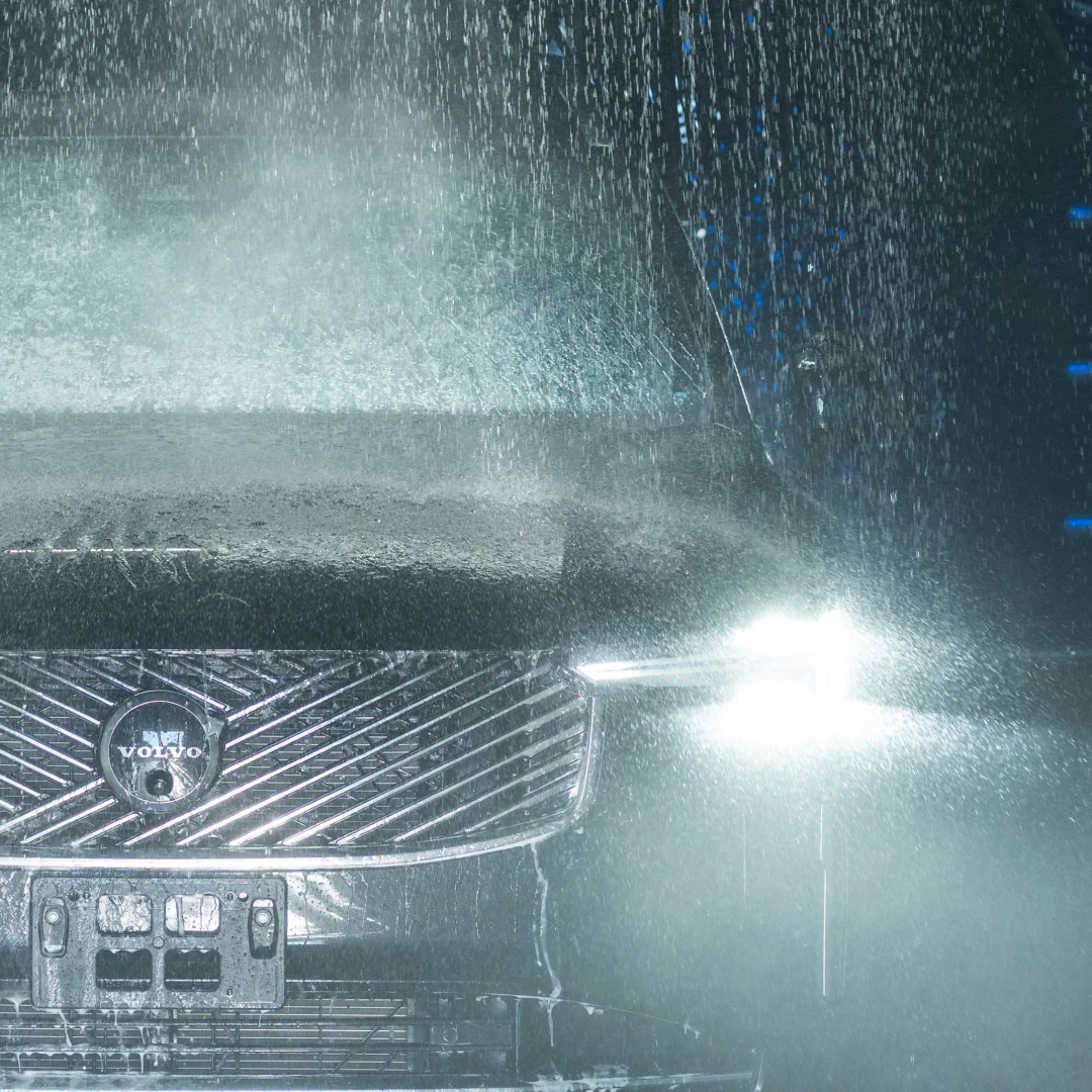 Close-up of a Volvo grille under the wash spray