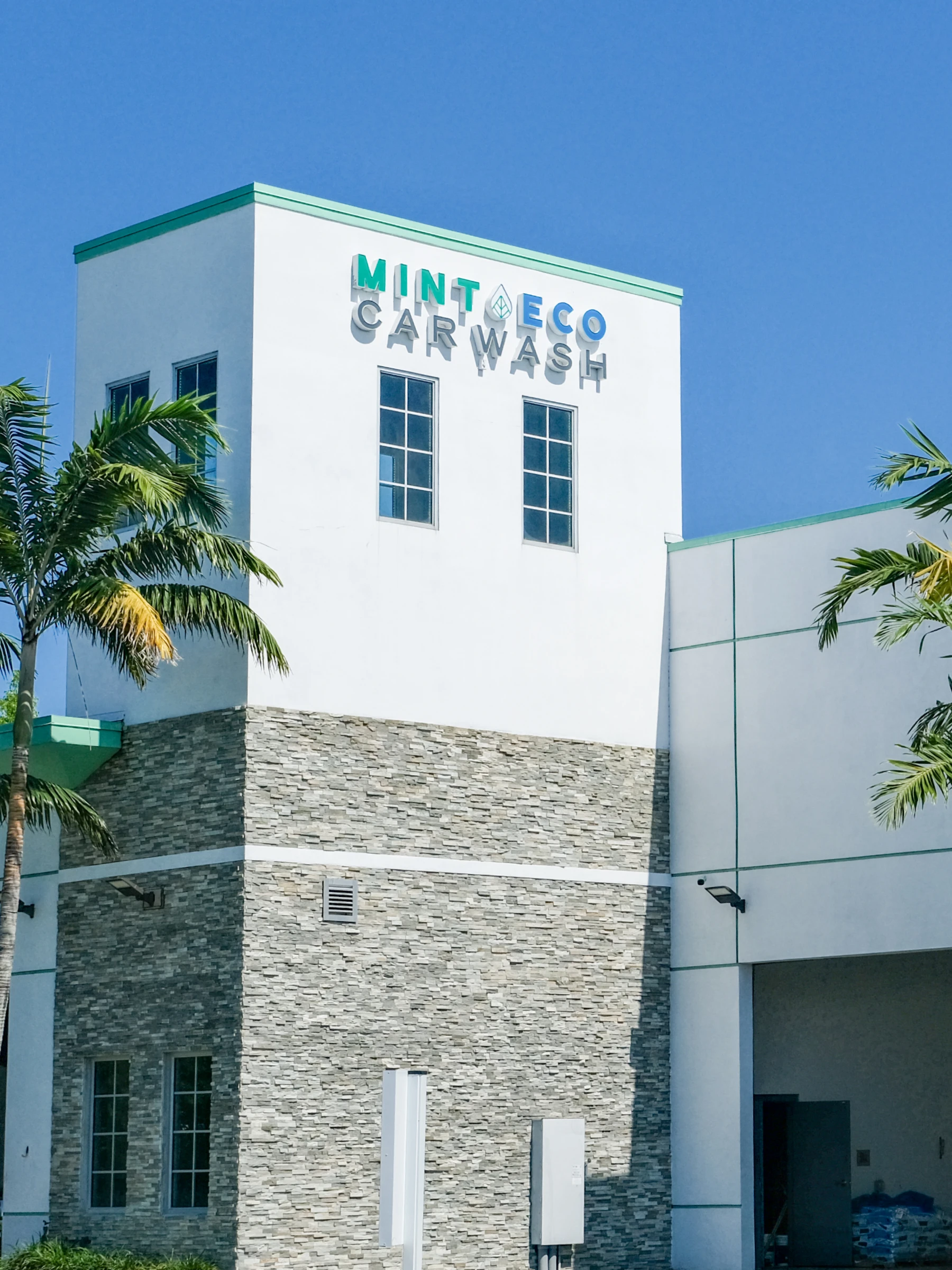 Mint Eco Car Wash building signage at the Okeechobee Blvd and Turnpike West location