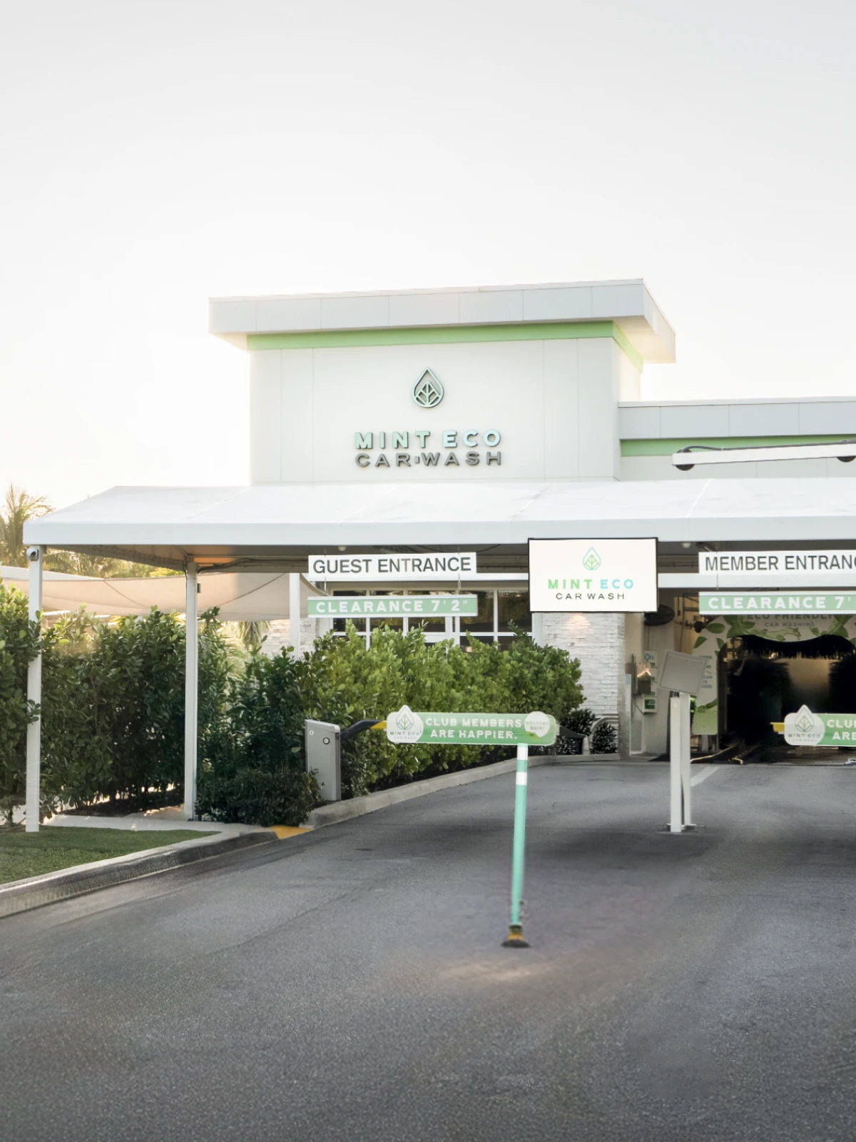 Mint Eco Car Wash entrance tunnel with guest and member lanes at the Palm Beach Lakes location